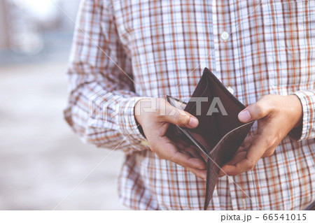 Man hand open an empty wallet isolated Man hand open an empty wallet isolated 66541015
