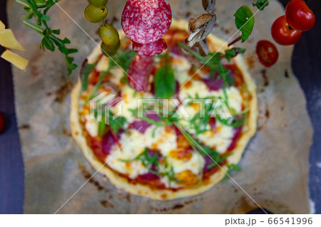 overhead top view of pizza cooking overhead top view of pizza cooking 66541996