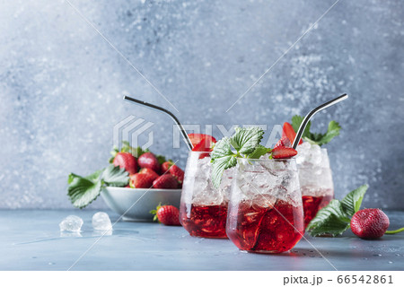 Red cocktail with ice and fresh strawberry Red cocktail with ice and fresh strawberry 66542861