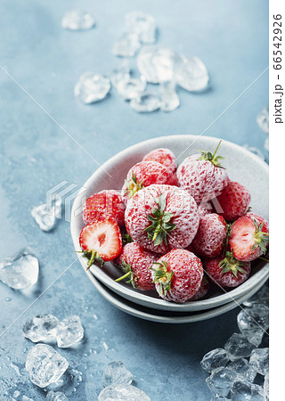 Frozen strawberry with crystals of ice 66542926