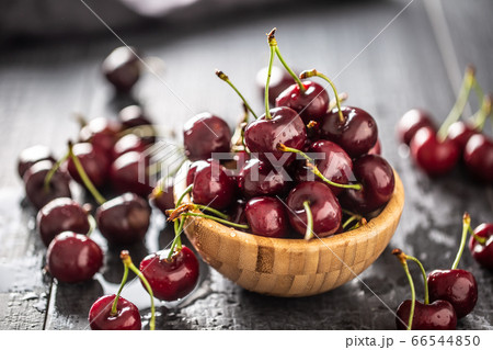 Fresh cherries washed in clean water in a bowl and 66544850