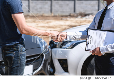 Insurance Agent and customer shaking hands after Insurance Agent and customer shaking hands after 66545817