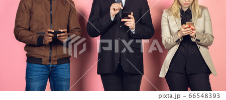 Group of friends using mobile smartphones. Teenagers addiction to new technology trends. Close up. 66548393