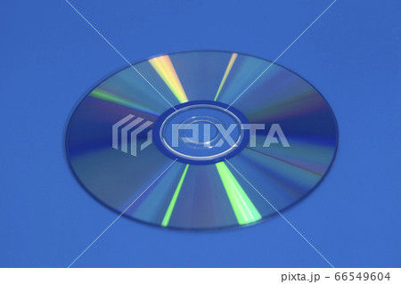 Compact Dvd Cd disk on blue background Compact Dvd Cd disk on blue background 66549604