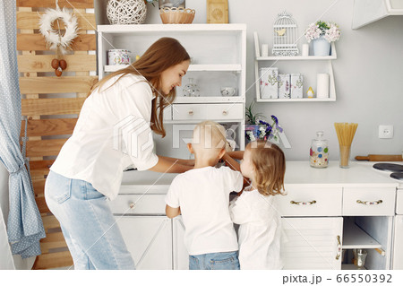 Mother with little children having fun at home 66550392