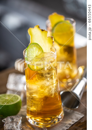 Refreshing ginger ice lemonade in two glasses Refreshing ginger ice lemonade in two glasses 66550443