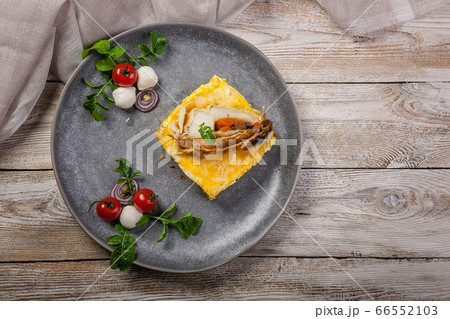 Top view omelet with fish fillet. Baked pangasius 66552103