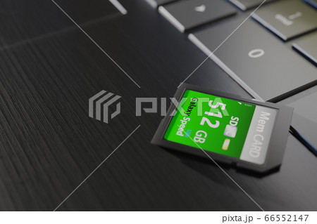 High capacity memory card on laptop close-up. SDXC 512 gb. Modern storage devices concept. Top angle view. Keyboard buttons in frame. Selective focus. 3D render High capacity memory card on laptop close-up. SDXC 512 gb. Modern storage devices concept. Top angle view. Keyboard buttons in frame. Selective focus. 3D render 66552147