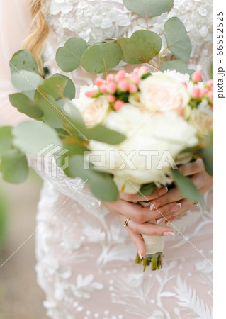 Closeup cute bride bouquet of roses. Closeup cute bride bouquet of roses. 66552525