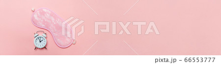 Vintage alarm clock Isolated on pink pastel 66553777