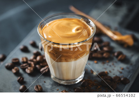 Dalgona coffee with whipped foam in cup 66554102