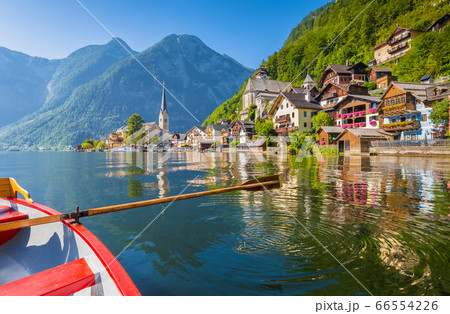 Classic view of Hallstatt with traditional rowing boat in summer, Austria 66554226