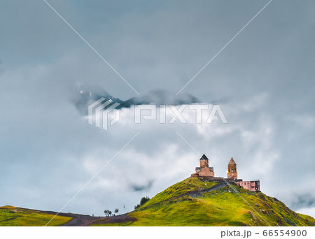 Ancient Gergeti Trinity church near mount Kazbek, Georgia 66554900