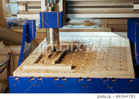 Machine tool in wood factory with drilling cnc machines. Computer numerical control Machine tool in wood factory with drilling cnc machines. Computer numerical control 66564783
