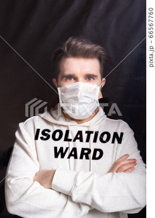 Hospital quarantine or isolation of patient standing alone in room with hopeful for treatment of Coronavirus COVID-19 Pandemic, Outbreak Efforts prevent virus spreading hazard controls concept. Hospital quarantine or isolation of patient standing alone in room with hopeful for treatment of Coronavirus COVID-19 Pandemic, Outbreak Efforts prevent virus spreading hazard controls concept. 66567760
