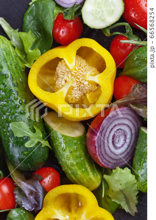 Wet vegetables with water droplets. Wet vegetables with water droplets. 66568254