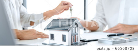 Real estate agent Sales manager holding filing 66568708