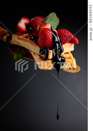 Belgian waffles with strawberries, mint and 66569543