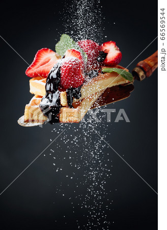 Belgian waffles with strawberries, mint and 66569544