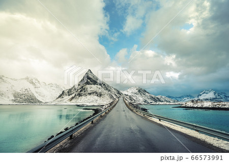 Olstind Mount and asphalt road. Lofoten islands, 66573991