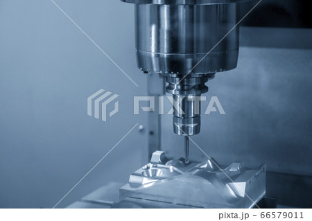 The  CNC  milling machine cutting  the mold parts. 66579011
