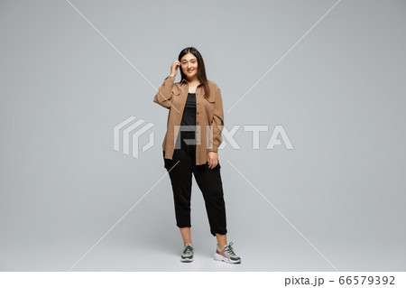Young caucasian woman in casual wear. Bodypositive female character, plus size businesswoman 66579392
