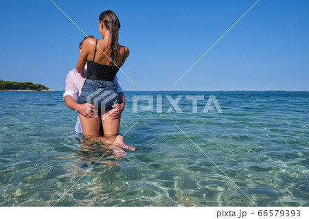 Happy couple in love on beach summer vacations. Happy couple in love on beach summer vacations. 66579393