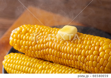 Melted butter on sweet corn. 66580659