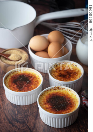 creme brulee and ingredients, milk, egg and sugar 66580991