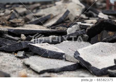 Fragments asphalt from road surface, destruction 66582375