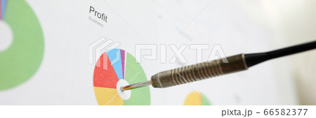 Dart sticking out from financial diagram as profit pursuit symbol 66582377