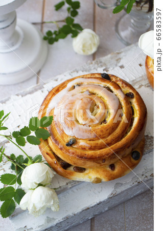 Cinnamon bun swirled with raisins, vintage and shabby style Cinnamon bun swirled with raisins, vintage and shabby style 66583597