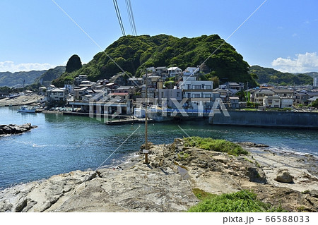 安房鴨川市の仁右衛門島亀岩展望台から対岸太海の町並みの写真素材