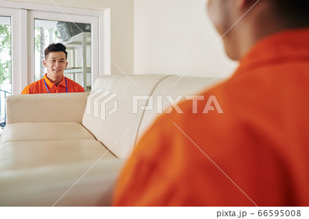Two Men Carrying Sofa 66595008