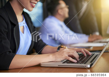 Unrecognizable People Working In Office 66595964