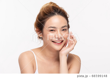 Beautiful Asian young woman touching soft cheek smile with clean fresh skin Happiness 66599148