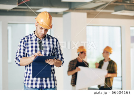 Modern Engineer Using Tablet 66604163