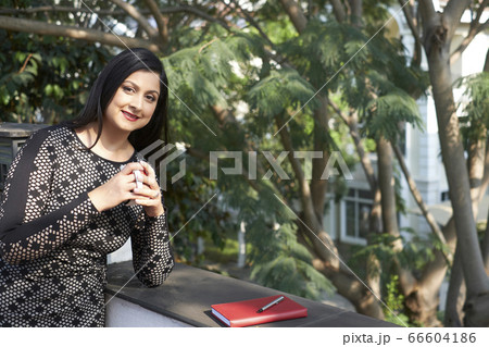 Businesswoman Having Coffee Break 66604186