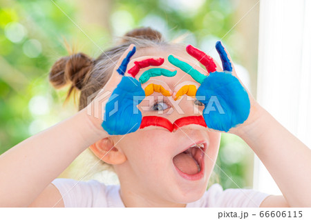 Little Girl featuring painted hands Concept Education, School, Creativity Favorite Focus. Little Girl featuring painted hands Concept Education, School, Creativity Favorite Focus. 66606115
