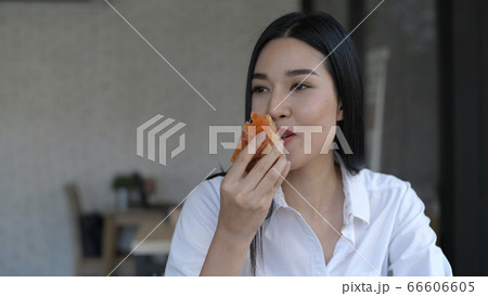 Holiday concept. Young women eating delicious Holiday concept. Young women eating delicious 66606605