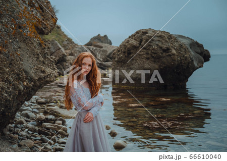 beautiful young girl in the morning under the 66610040