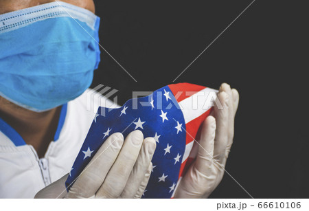 Medical personnel holding the American flag 66610106