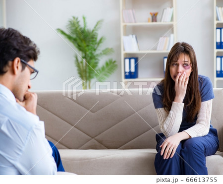 Psychologist counselling woman beaten by husband 66613755