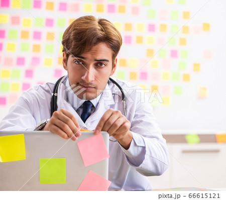 Male doctor with many conflicting prioritites 66615121