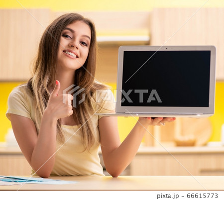 Woman blogger presenting on her laptop Woman blogger presenting on her laptop 66615773