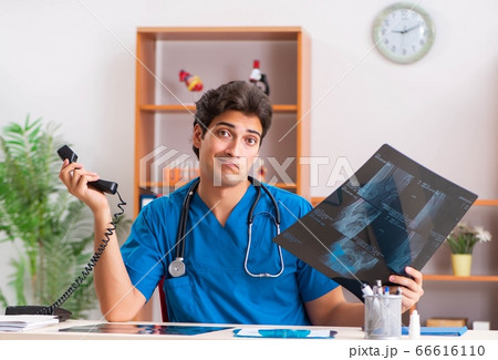 Young handsome doctor radiologyst working in clinic 66616110