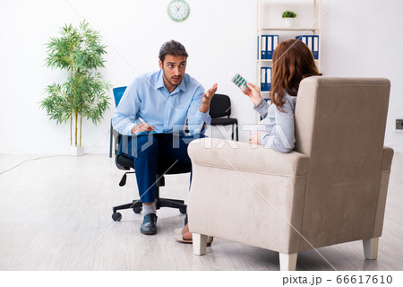 Pregnant woman visiting young male psychologist Pregnant woman visiting young male psychologist 66617610