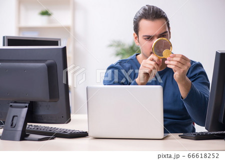 Young male it specialist working in the office Young male it specialist working in the office 66618252