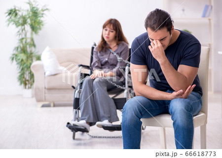 Disabled wife and young husband at home Disabled wife and young husband at home 66618773