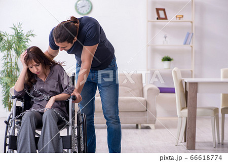 Disabled wife and young husband at home 66618774